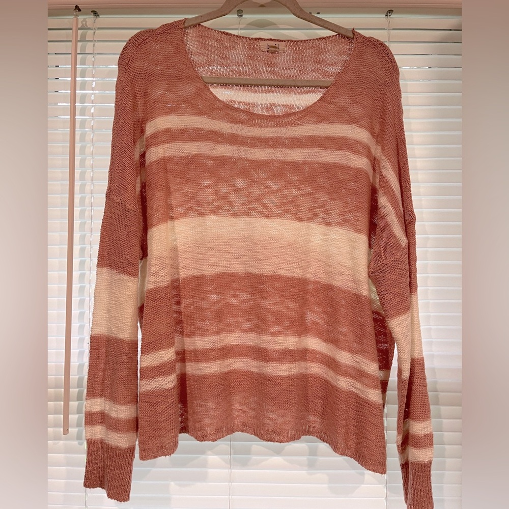 Oversized striped coral sweater.